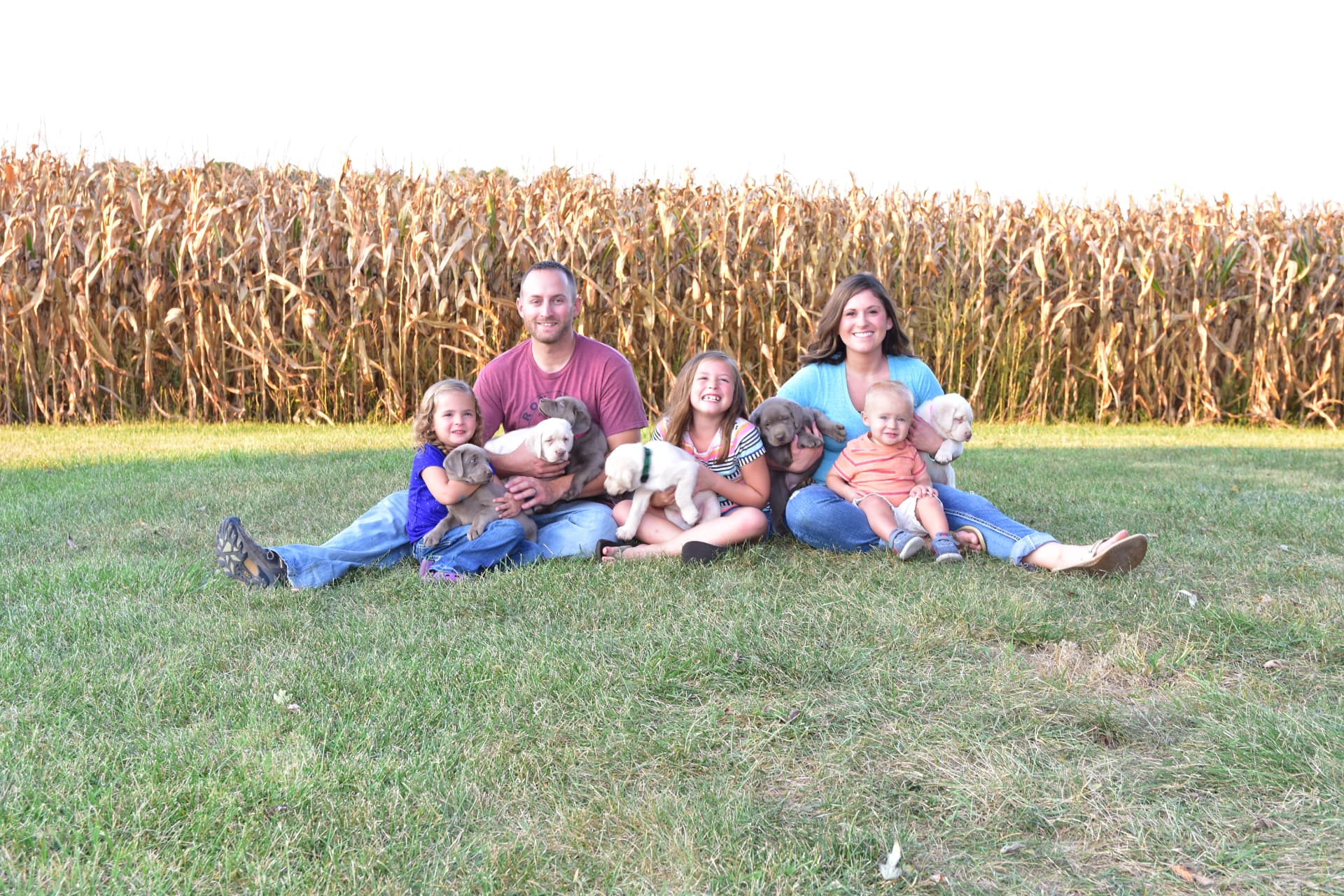 The Sterling Prairie family with puppies in 2017